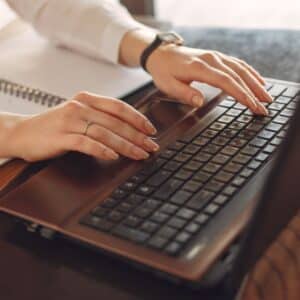 typing on laptop