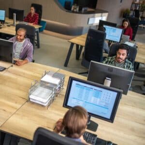 tech workers in open office setting