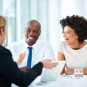 two people smiling in professional consultation