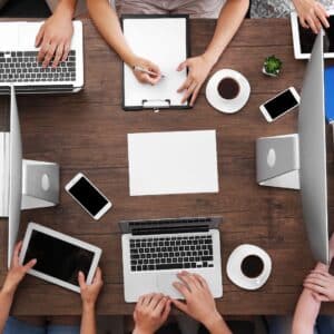 business meeting with table of devices