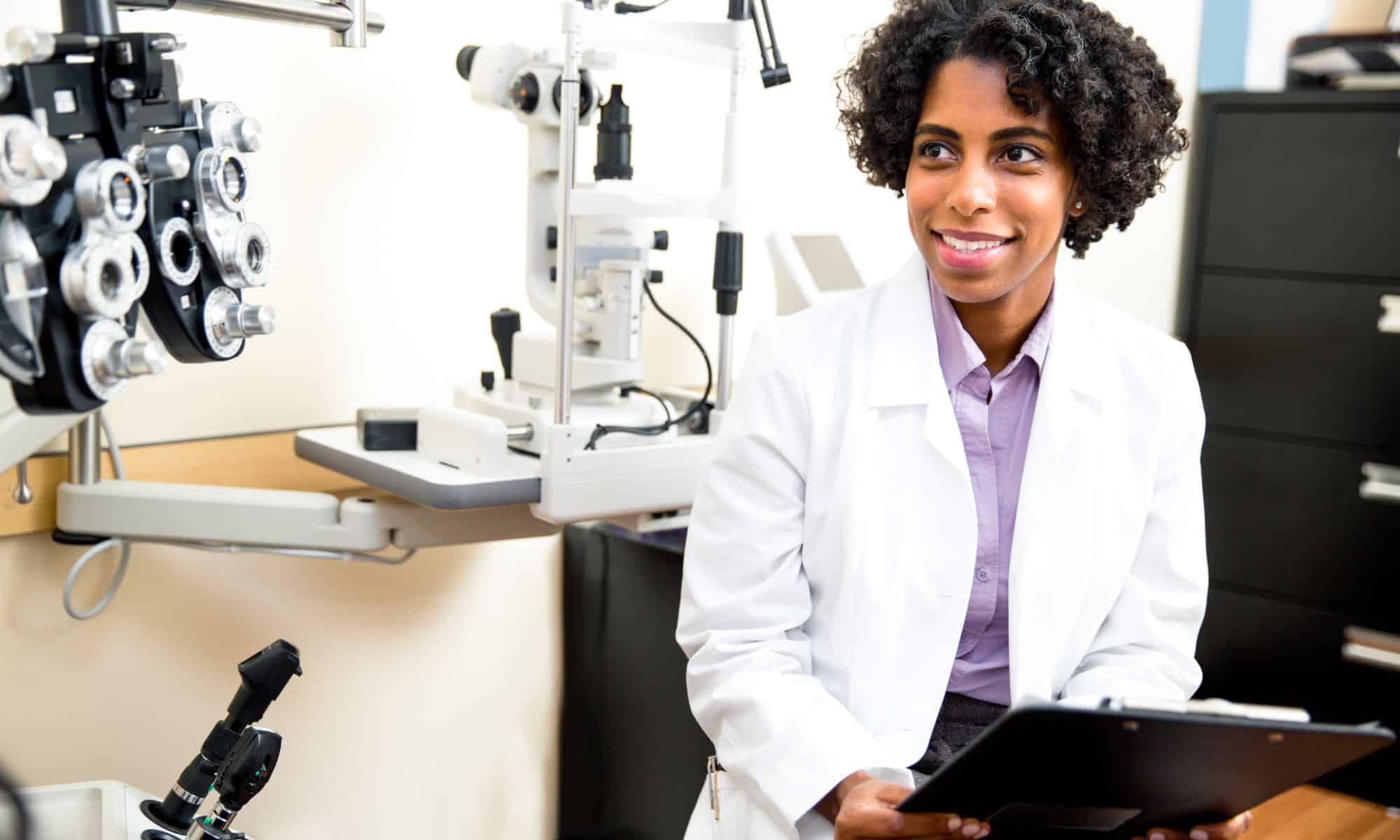 Dentist with tablet talking with a patient