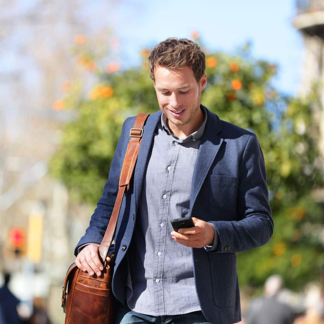 man checking burglar alarm system from his phone