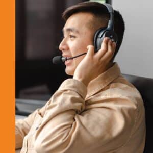 a man on the phone with a headset

