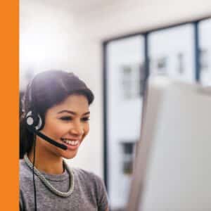 a women on a headset working from home