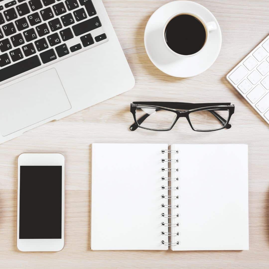 Business phone and desk materials.